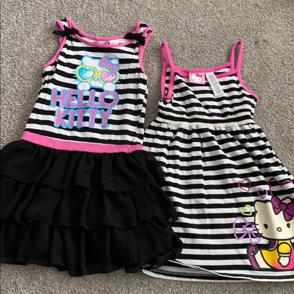 Two stripped Hello Kitty dresses.
